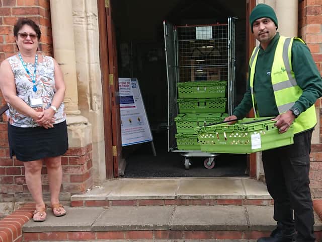 Yolanda Jacob, Executive Assistant and Fundraising Manager at the Horton receives a delivery of packed sandwiches from Aldi's Banbury store