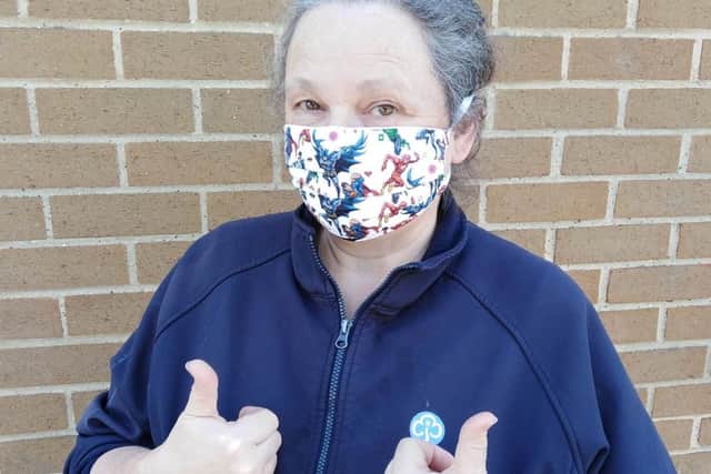 Kay Stevens wears a super hero protective mask made by the MC All Stitched Up Group