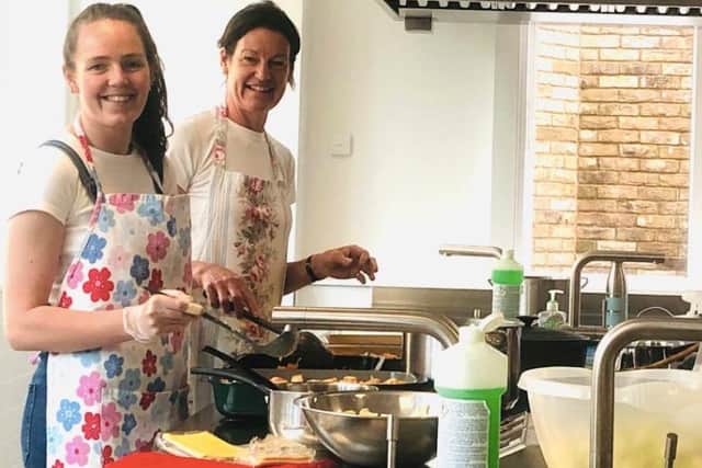 Volunteers, Emma, and her daughter Camilla, work on preparing the home-made meals for the NHS at the Tudor Hall School kitchen as part of the Food4Heroes scheme