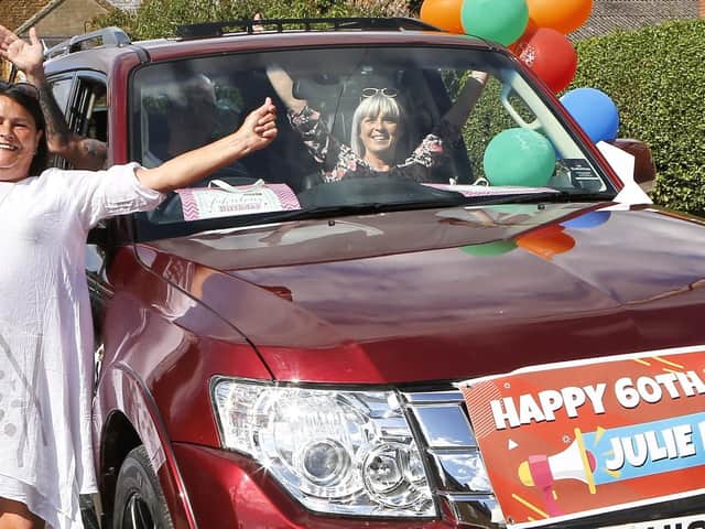 Julie Brain enjoys the love of friends and neighbours at her 60th birthday drive-by. Picture by Clarke Penrice