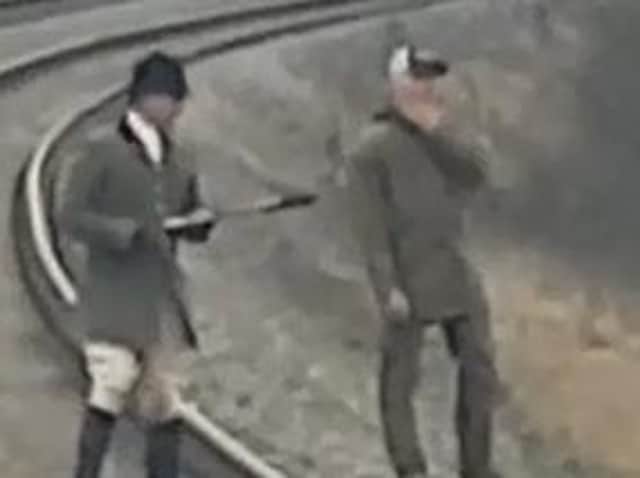 One of the images released by British Transport Police in an effort to discover the identity of huntsmen on the track, holding up a passenger train on New Year's Day