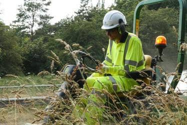 Oxfordshire County Council employee cutting grass (photo from Oxforshire County Council)