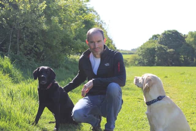 Andrew Cotter with Mabel and Olive (photo from Dogs for Good)
