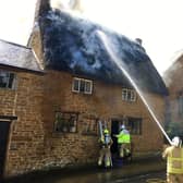 Fire fighters tackle the blaze at a cottage in Miller's Lane, Hornton on Sunday afternoon