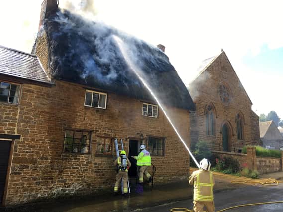 Fire fighters tackle the blaze at a cottage in Miller's Lane, Hornton on Sunday afternoon
