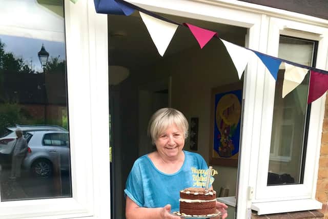 Anne Watts was surprised to find a cake and a Happy Birthday serenade from friends and neighbours to help celebrate her 80th birthday at her home in Lower Tadmarton