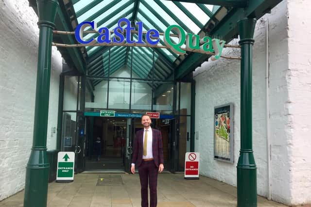 Oliver Wren, the director of Castle Quay Shopping Centre, stands at one of its entrances, which has a new one-way traffic flow system set up