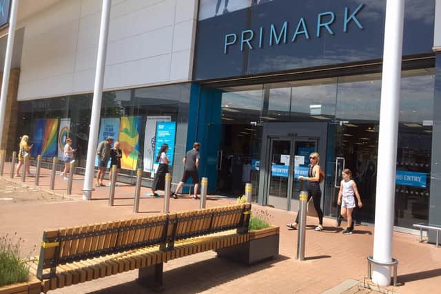 A few people wait to enter Primark store at the Banbury Gateway Shopping Park on Monday June 15