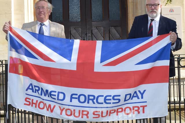 Banbury Mayor John Colegrave on the left and the leader of the town council Cllr Kieron Mallon at the right raise the Armed Forces Flag on Monday June 22