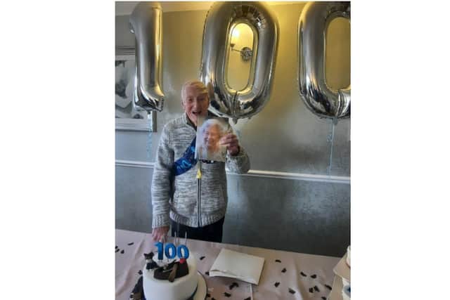 Francis Orchard holds the card he received from the Queen for his 100th birthday at the Larkrise Care Centre in Banbury. (Submitted photo)