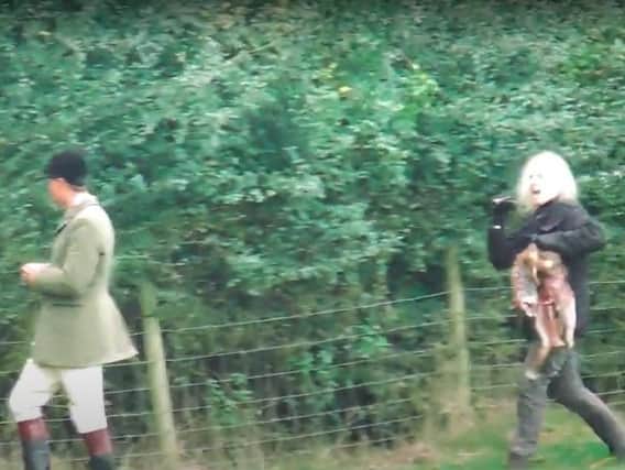 This video by the West Midlands Hunt Saboteurs shows an anti-hunt campaigner confronting a huntsman with dead fox in south Warwickshire after she dragged it out of the mouths of hounds