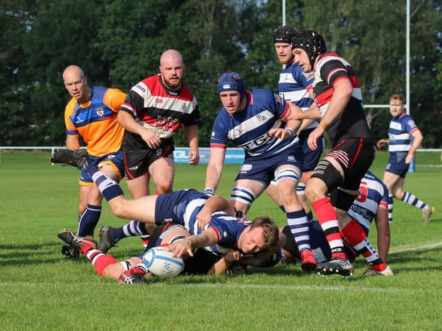 Ed Phillips scores one of his two tries in Banbury’s victory over Frome which sees them second in the table               Picture by Simon Grieve