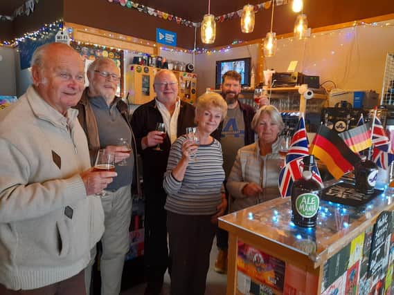 Members of the Banbury and District Twinning Association tasting the Banbury beer on sale at The Apothecary Tap (Pictured: Gareth Jeremy, Lloyd Taylor, Alan Cooper, Jenny Tustian, and Catherine Jenkinson and Rob Foreman, the owner of  The Apothecary Tap.)
