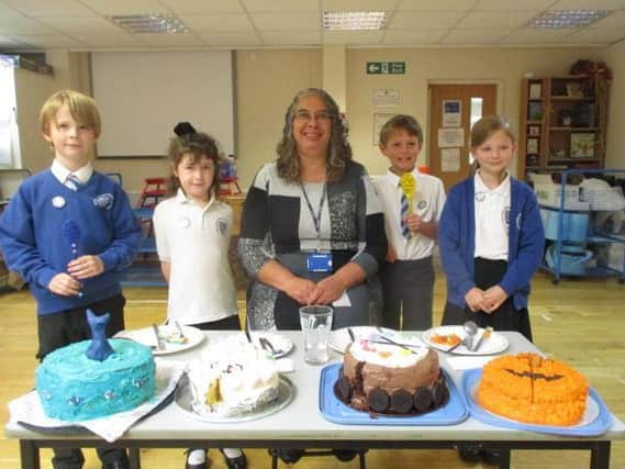 Wroxton Primary Headteacher Mrs April Guiness and several pupils who took part in the The Great Wroxton Bake Off (submitted photo from the school)