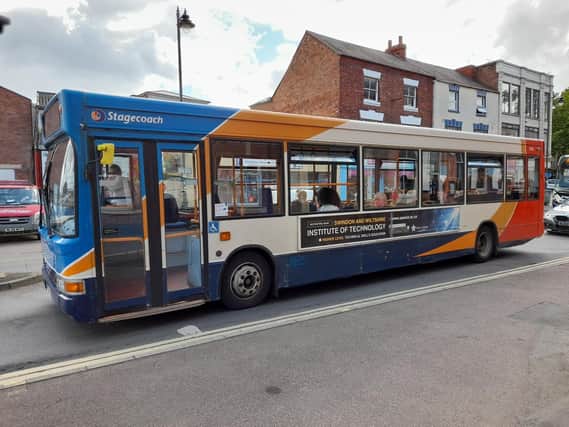 A bus travelling through the Banbury town centre