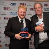Kaleb Cooper and Jeremy Clarkson are pictured with the special award