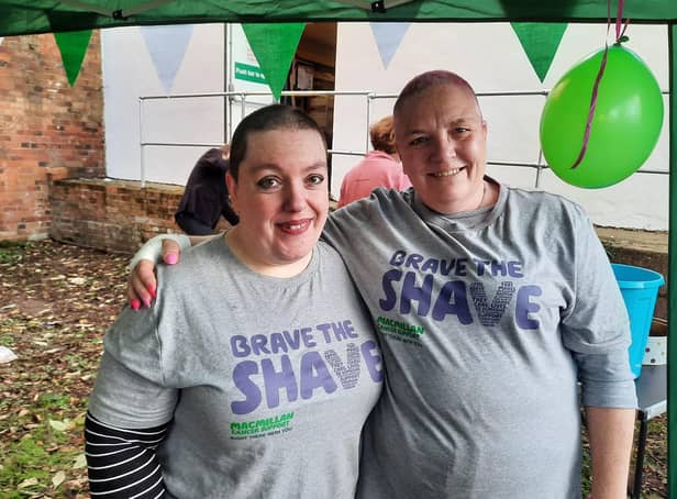 Sarah Humphrey and Pat Davis are pictured after their heads were shaved in a fundraising effort for Macmillan