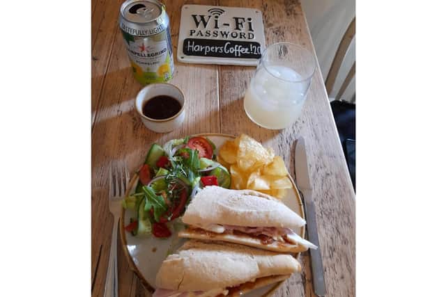 The featured menu item of a honey roasted ham and brie baguette layered with fig and honey chutney available at Harper's Coffee House in Adderbury