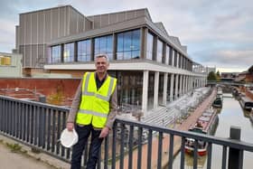 Keith Pullinger, the co-founder and deputy chairman of the Light cinema, stands in front of the new Light cinema and leisure venue alongside the Oxford Canal in Banbury