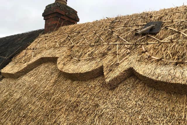 The intricate detail at the roof top of the thatched cottage replaced by Michael Stanley in Bodicote