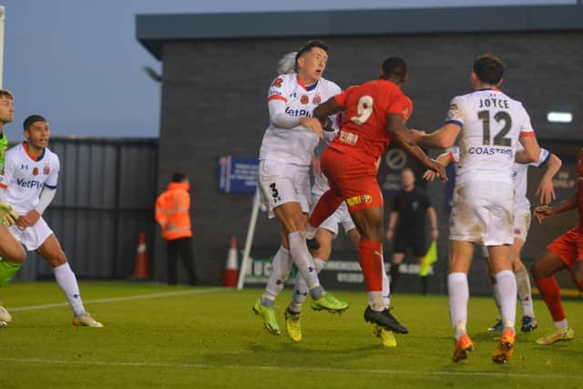 Lee Ndlovu heads home Brackley Town's and his second goal at Fylde