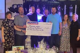 Andrew Gill and Melissa Fazackerley with Dementia Active the Banbury-based charity, and a few members of Kelly’s Heroes, who presented the charity with the cheque.