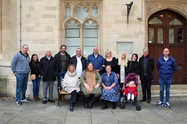 Family members of former Banbury mayor and councillor George Parish stand behind the memorial bench placed in his memory outside town hall (submitted photo)