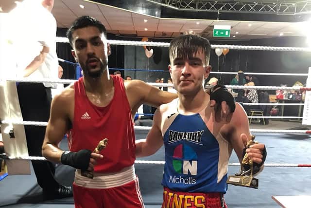 Banbury Boxing Club’s George Miles (in blue) with his opponent  Jamal Kayani