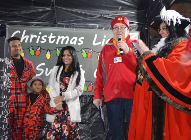 Local community hero Prabhu Natarajan, his six-year-old son Addhu and his wife Shilpa and the Banbury Mayor Shaida Hussain on stage the town's Christmas lights switch-on event on Sunday November 28 (photo from Banbury Town Council)