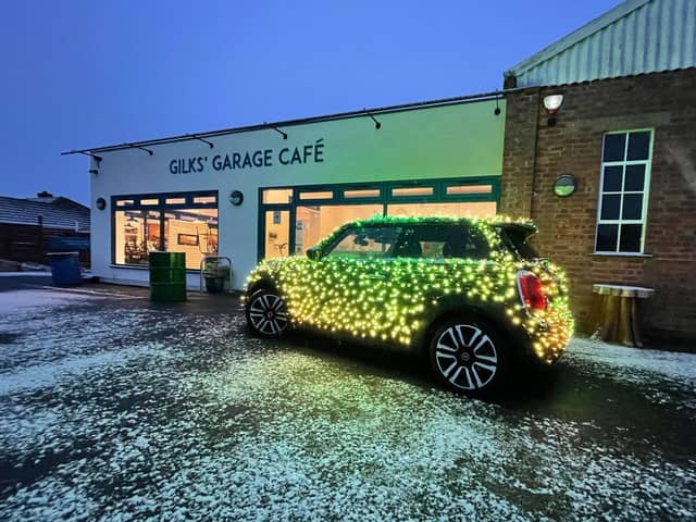 Nicholas ’Nico’ Martin and his festive MINI Electric car made a stop at Gilks' Garage Cafe for its Christmas market on Sunday November 28 (Submitted photo)