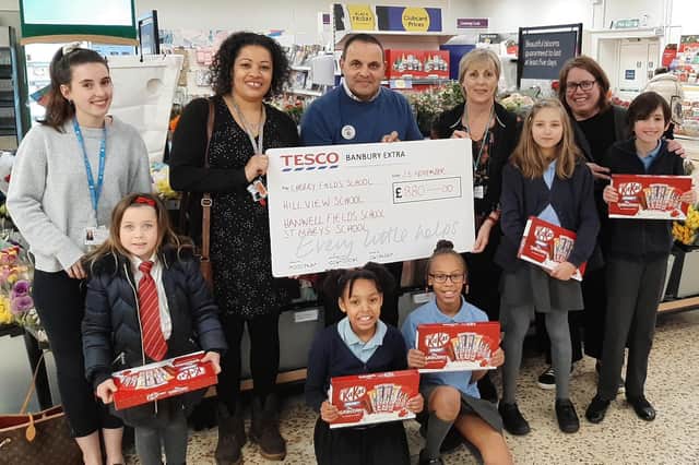 Tesco Extra raised £880 for four local schools. Pictured: -Vicki Wingrove from Cherry Fields, Rebecca Lister from Hanwell Fields, Dinah Gregory from Hill View, Victoria Woods from St Mary's and Simon Howes, a store manager at Tesco. (Submitted photo)