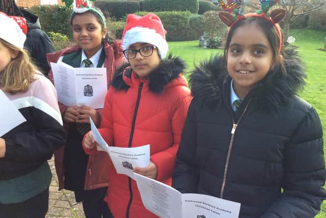 Dashwood Primary pupils Anokee Kini, Eshal Hussain and Keya Mistry who sang Christmas songs and carols for residents at a local Banbury care home (submitted photo from the school)