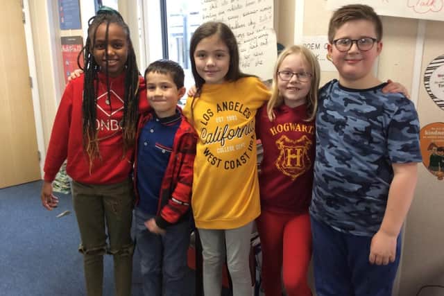 Pupils from Dashwood Primary wore the colours of the emergency services: red, blue, green or orange to mark Unite The Uniforms day - pictured: Aaidah Njie, Eric Durkin, Lacey King, Amber Harcastle andNoah Perry-Newman (Submitted photo from the school)