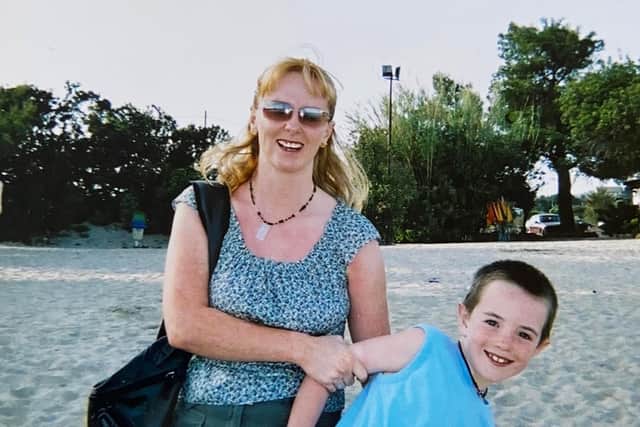 Rory, aged eight, and his mum Jacqui on the beach during a family holiday on Ibiza