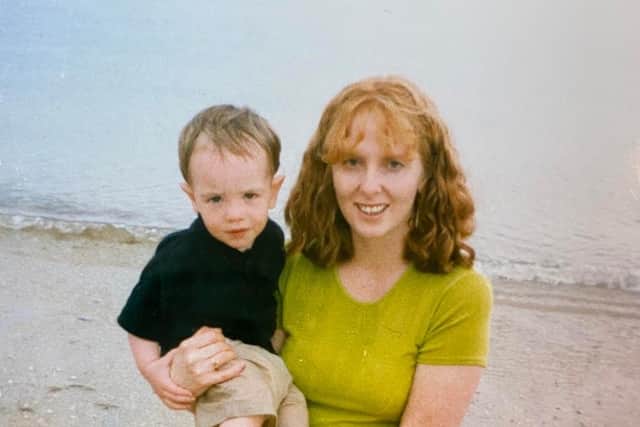 Three-year-old Rory in his mum Jacqui's arms on the beach in Cornwall