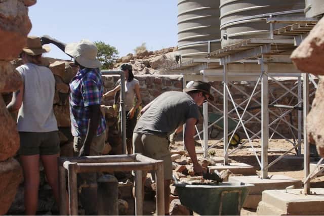 Volunteers visit the desert areas to help build protective walls around water stores and also excavate alternative supplies for the elephants