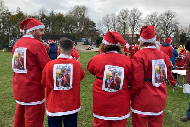All four members of the Brown family wore tribute pictures to David Allington, who received hospice care from Katharine House Hospice earlier this year and ran in the event with his family in 2019. (Submitted photo from KHH)