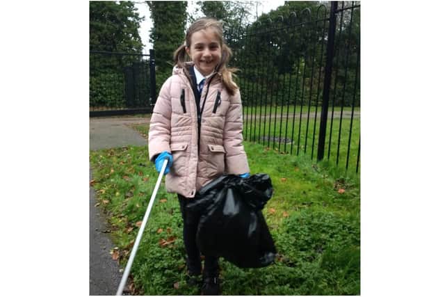Bella Fisher, a pupil at Banbury's Harriers Academy carries out litter picking activity (Image submitted by the school)