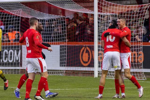 Brackley Town celebrate Matt Lowe's winning goal as they beat Guiseley 1-0 to move to the top of the National League North. Picture by Glenn Alcock