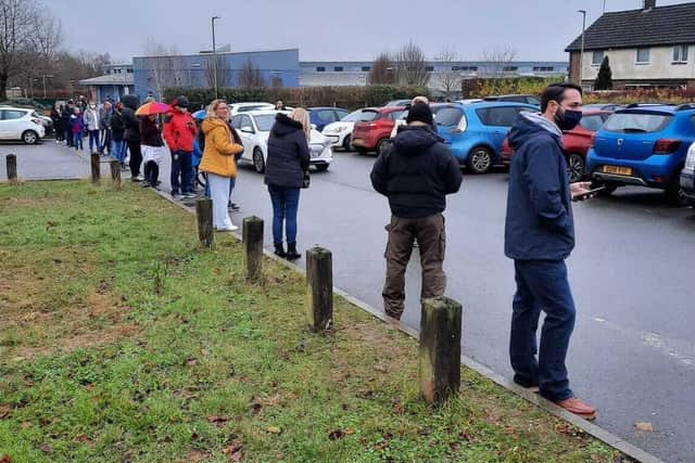 The early birds who queued up for their booster jab in Banbury on Sunday