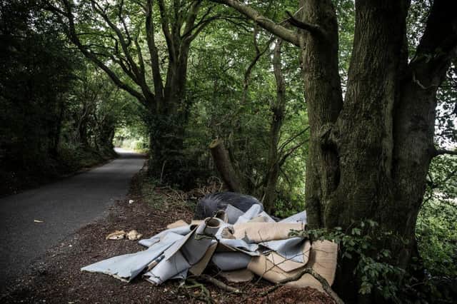 Fly-tipping is on the increase - quiet country lanes and farm gateways are often used by people dumping unwanted rubbish Picture by Getty