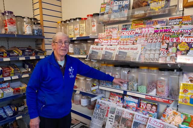 Barry Lane points out some the popular sweets inside his Banbury community newsagents, Lane's News, which set to close next week