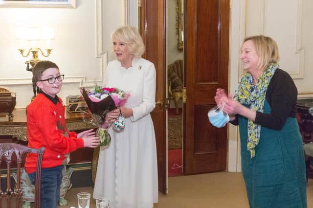 Ten-year-old Banbury boy, Nathan Best, presents flowers to the Duchess of Cornwall with Clare Periton, the CEO of Helen & Douglas House hospice (photo submitted by the hospice)