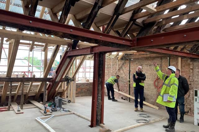 Builders work on the roof of the Smart Tots Day Nursery building in the town centre of Banbury (Submitted photo)