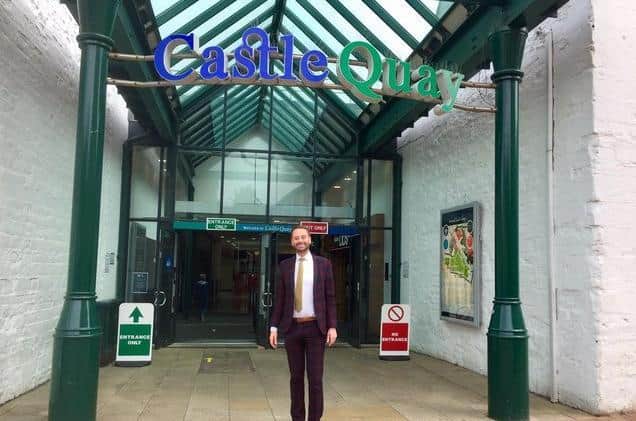 Oliver Wren, centre director at Castle Quay Shopping Centre, stands at one of the entrances to the shopping centre