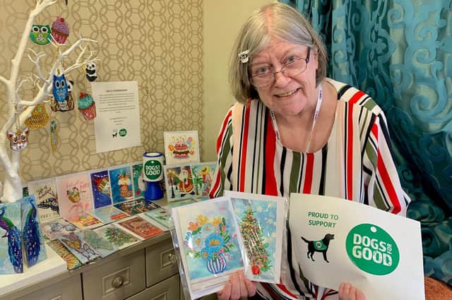 Highmarket House care home resident Val with some of her creations which she made and sold to help Banbury-based charity, Dogs for Good (Submitted photo)