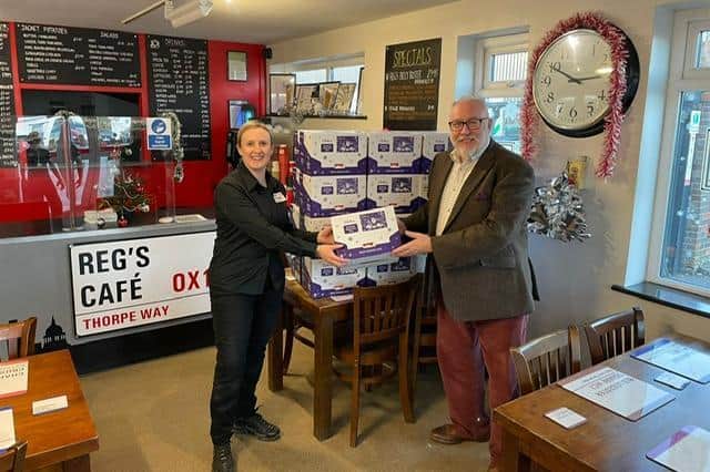 Reg's Café & Reg's Catering owner, Alison Howe, presenting selection boxes to Banbury Town Cllr Kieron Mallon on behalf of Banbury Food for Charities. (Submitted photo)