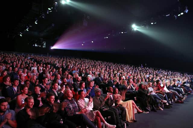 Research shows that regular cinema trips help boost wellbeing. Photo: Getty Images