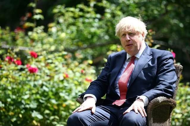 Boris Johnson pictured in the garden of No 10 Downing Street two months after the controversial Bring a Bottle party. Picture by Getty