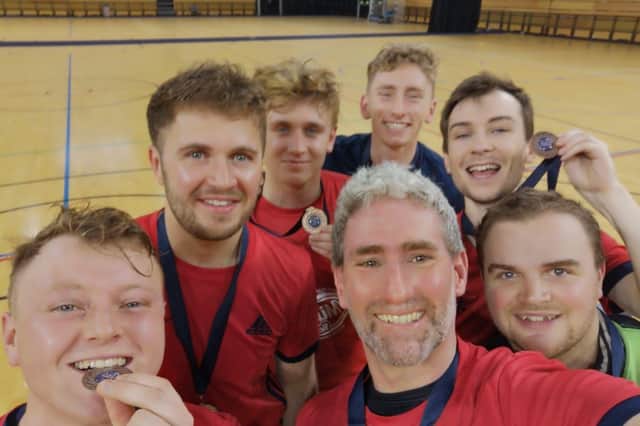 Celebrating with their bronze medals Allie Rose, Pete Lamb, Alfie Lawrence, Captain Harry Simons at the back, Joe Allen, Kit Lamb , and Ady Simons at the front.